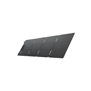 A single dark photovoltaic solar panel tilted diagonally, showing grid lines and mounting holes on the edges.
